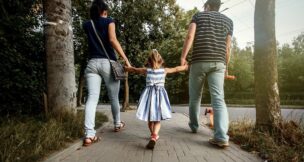 Couple walking with young child